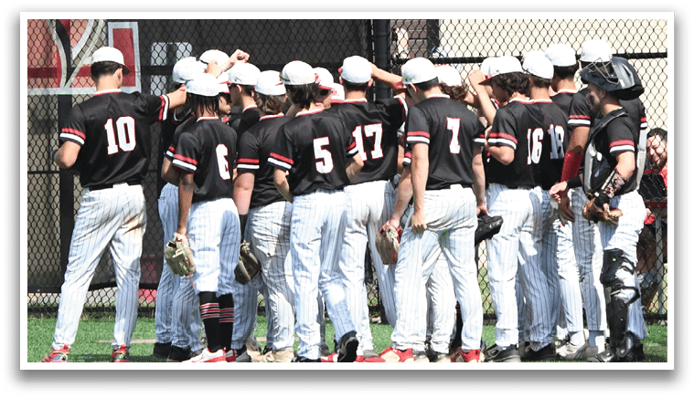 A group of baseball players wearing black and red shirts. Description generated by AI