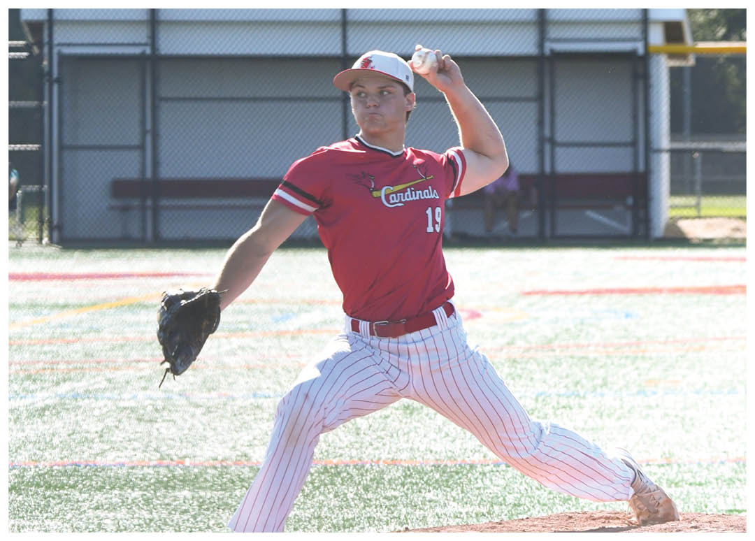 A baseball player in a red shirt and white pants is pitching a ball. Description generated by AI