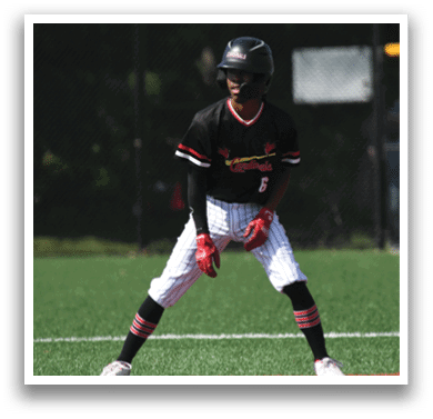 A young boy wearing a baseball uniform with the number 6 on the back. Description generated by AI