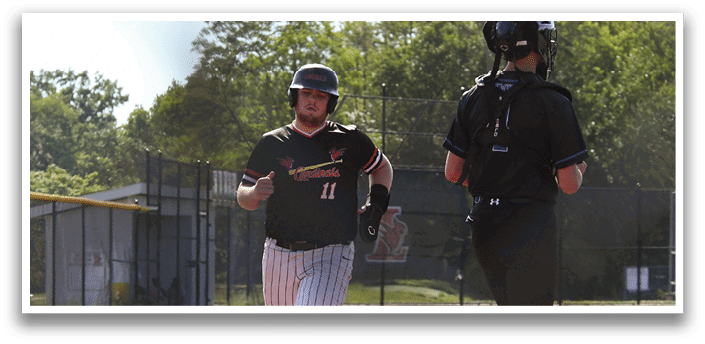 A baseball player in a black and white striped uniform is running on the field. Description generated by AI