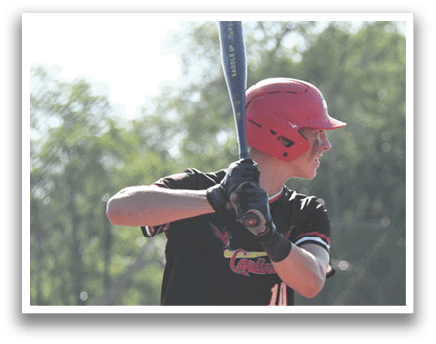 A baseball player is holding a bat and getting ready to swing. Description generated by AI