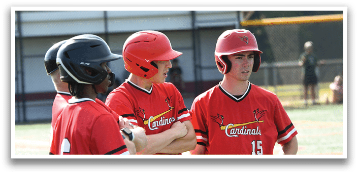 A group of baseball players wearing red and white uniforms. Description generated by AI