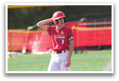A baseball player wearing a red shirt and a red helmet. Description generated by AI