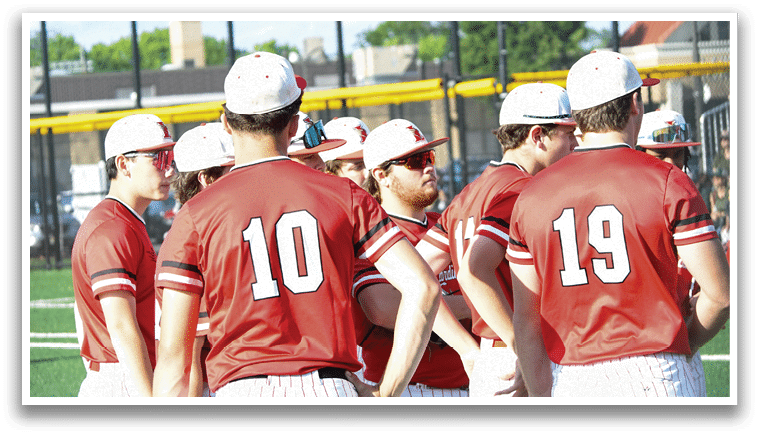 A group of baseball players wearing red and white uniforms. Description generated by AI
