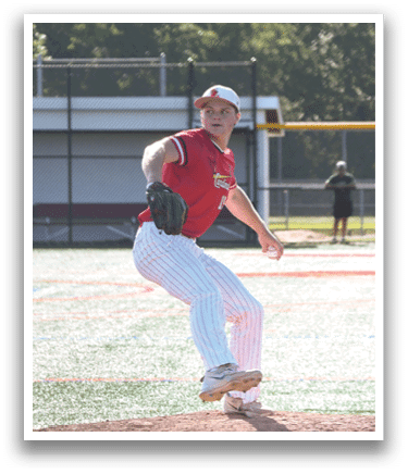 A man in a red shirt and white pants is pitching a baseball. Description generated by AI