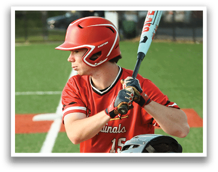 A baseball player in a red shirt and helmet holding a bat. Description generated by AI