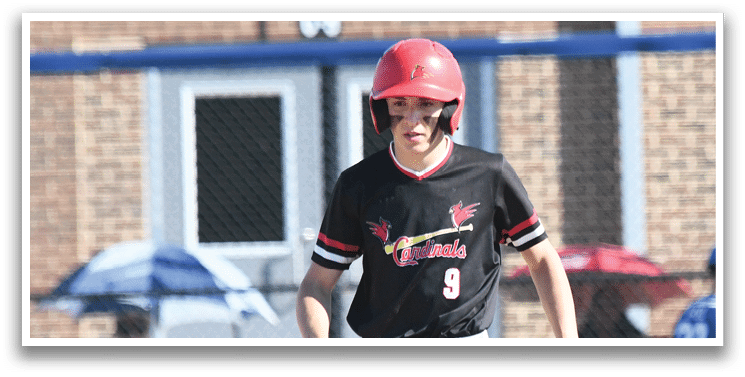 A baseball player wearing a red and white uniform with the number 4 on the back. Description generated by AI