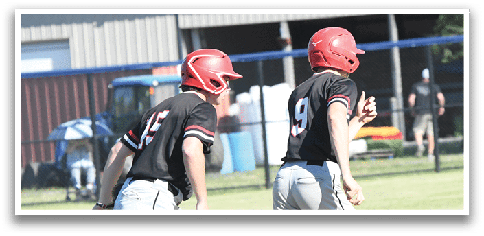 A group of baseball players wearing red and white uniforms. Description generated by AI