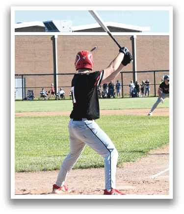 A man in a red shirt and white pants is pitching a baseball. Description generated by AI