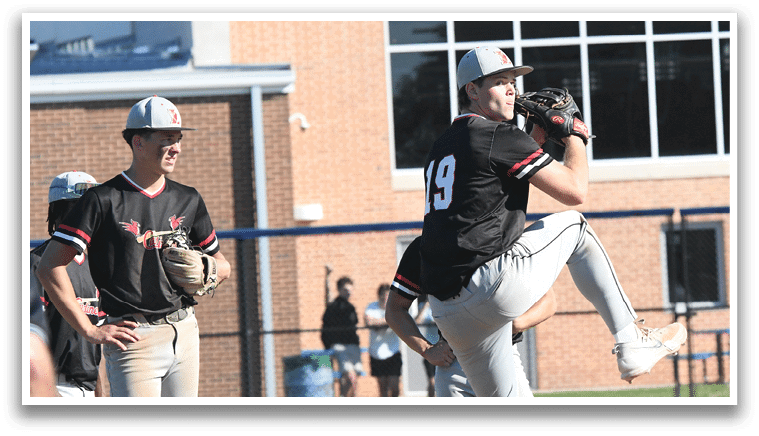 A group of baseball players wearing red and white uniforms. Description generated by AI