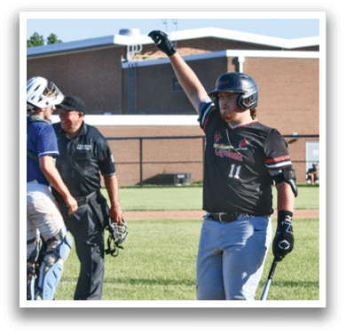 A baseball player wearing a red shirt and black helmet. Description generated by AI