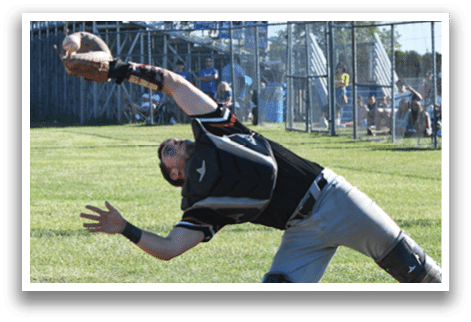 A baseball player wearing a red shirt and black helmet. Description generated by AI