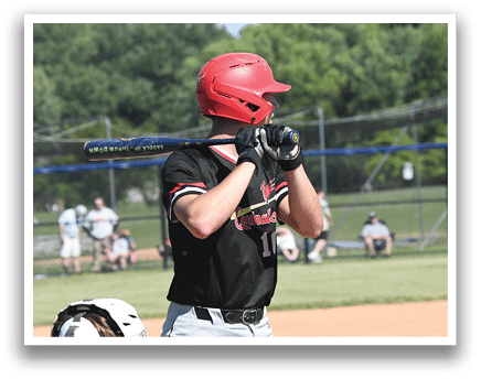 A baseball player is swinging a bat at a ball. Description generated by AI