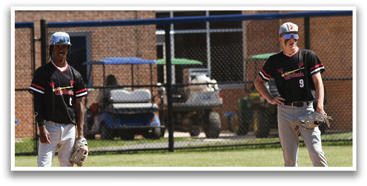 A baseball player in a red and white uniform is swinging a bat. Description generated by AI