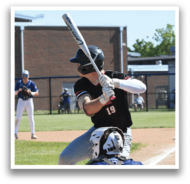 A baseball player in a red shirt and white pants is pitching a ball. Description generated by AI