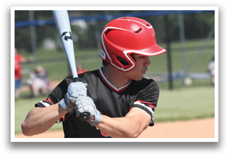 A baseball player holding a bat. Description generated by AI