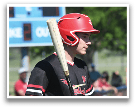 A baseball player wearing a red and white shirt with the number 9 on it. Description generated by AI