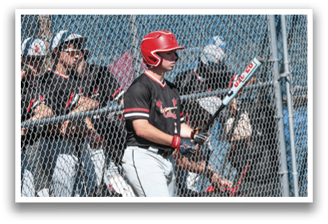 A baseball player wearing a red shirt and a red helmet. Description generated by AI