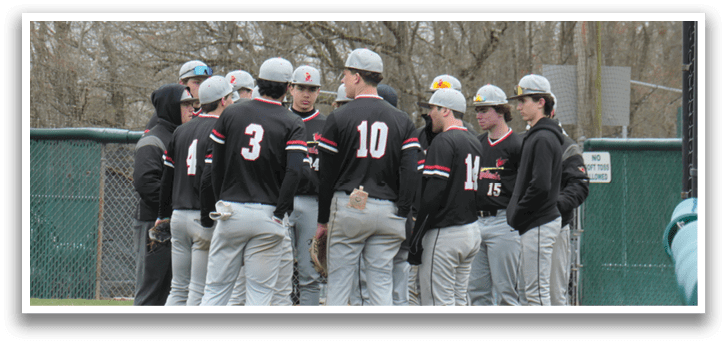 A group of baseball players wearing black and grey uniforms. Description generated by AI