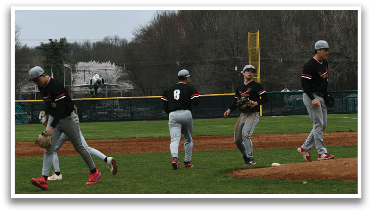 A group of baseball players on a field. Description generated by AI
