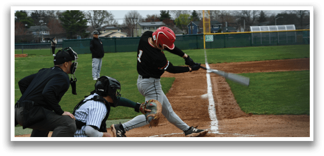 A baseball player is swinging a bat at a ball. Description generated by AI