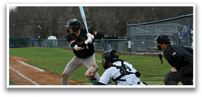 A baseball player is swinging a bat at a ball. Description generated by AI