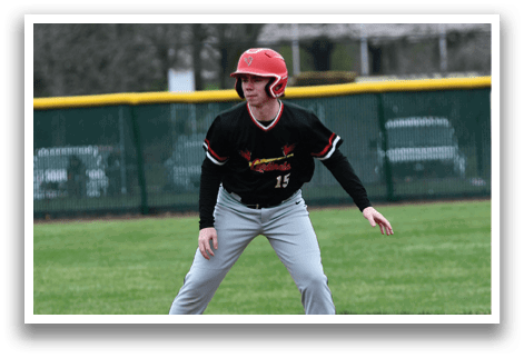 A baseball player wearing a red helmet and black shirt. Description generated by AI