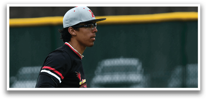 A baseball player wearing a black shirt and grey pants with a baseball glove. Description generated by AI