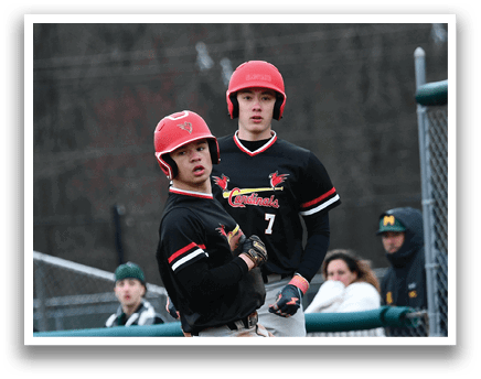 A baseball player wearing a red helmet and black jersey. Description generated by AI