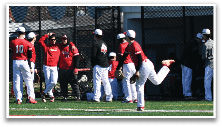 A group of baseball players wearing red and white uniforms. Description generated by AI