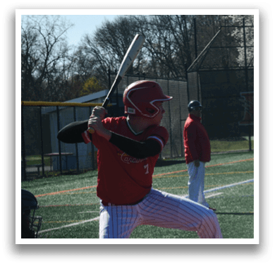 A baseball player in a red and white uniform is swinging a bat. Description generated by AI