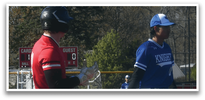 Two baseball players on a field. Description generated by AI