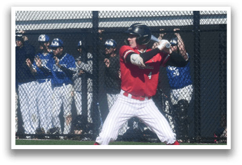 A baseball player is holding a bat and getting ready to swing. Description generated by AI