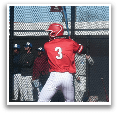 A baseball player in a red shirt and white pants is swinging a bat. Description generated by AI
