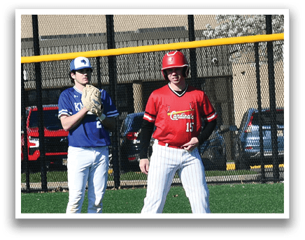 Two baseball players on a field. Description generated by AI