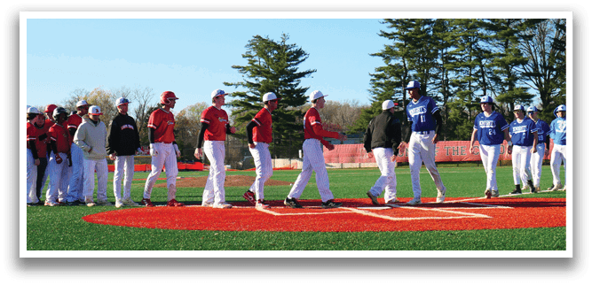 A group of baseball players standing on a field. Description generated by AI