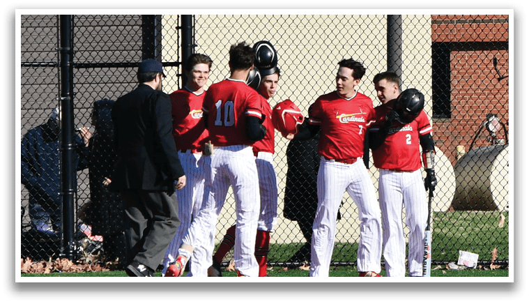The baseball players are wearing red and white uniforms. Description generated by AI
