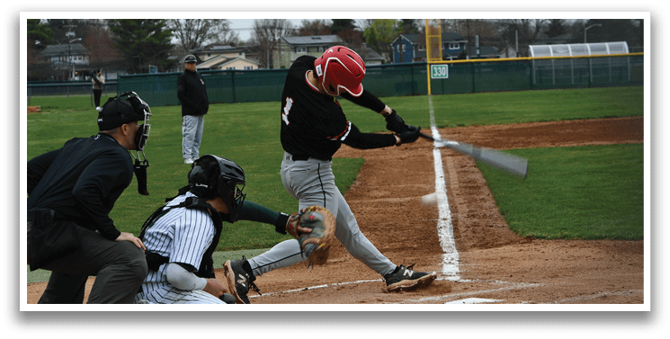 A group of baseball players wearing black and grey uniforms. Description generated by AI