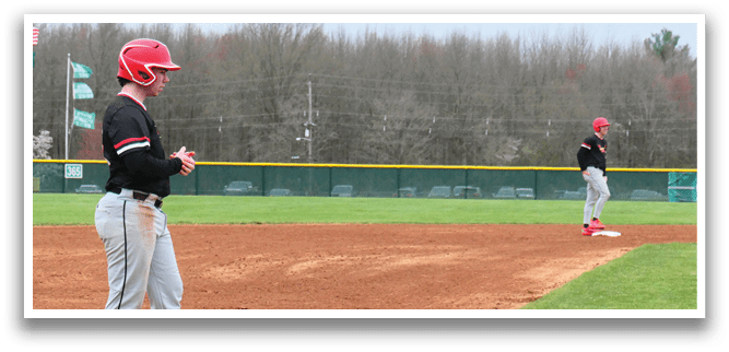 A baseball game is taking place on a field. Description generated by AI