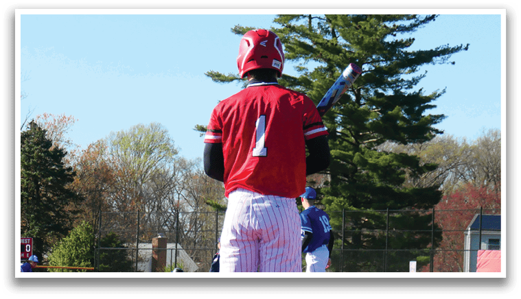 A baseball player is standing on the field. Description generated by AI
