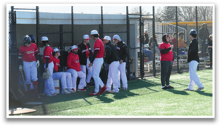 Baseball players in red and white uniforms. Description generated by AI
