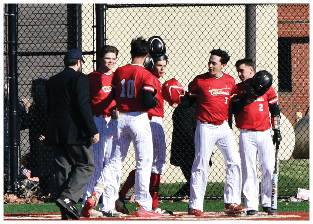 A group of baseball players hugging each other. Description generated by AI