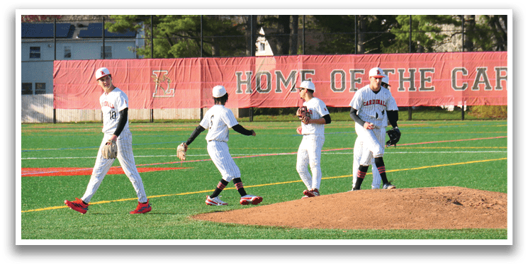 Three baseball players walking on a field. Description generated by AI