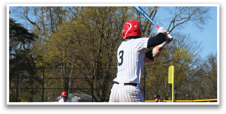 A baseball player is holding a bat and getting ready to swing. Description generated by AI