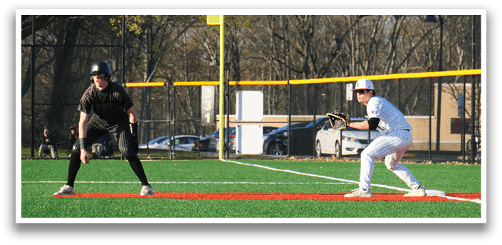 A baseball player is holding a bat and waiting for the ball. Description generated by AI