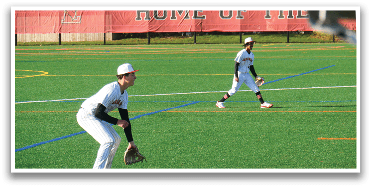 Two baseball players on a field. Description generated by AI