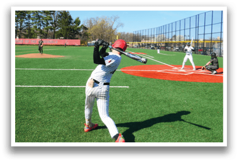 A baseball player is swinging a bat on a field. Description generated by AI