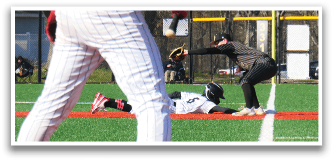 A baseball player is sliding into a base. Description generated by AI