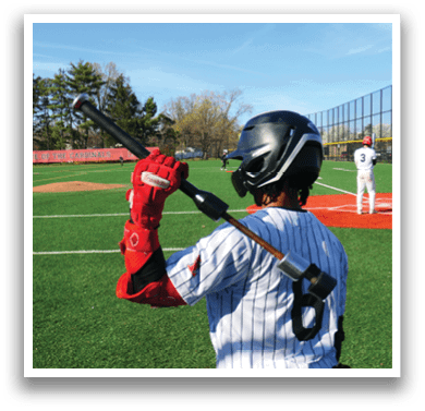 A baseball player holding a bat on a field. Description generated by AI