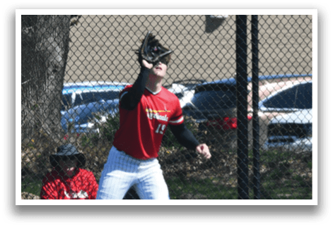 A baseball player in a red and white uniform is throwing a ball. Description generated by AI